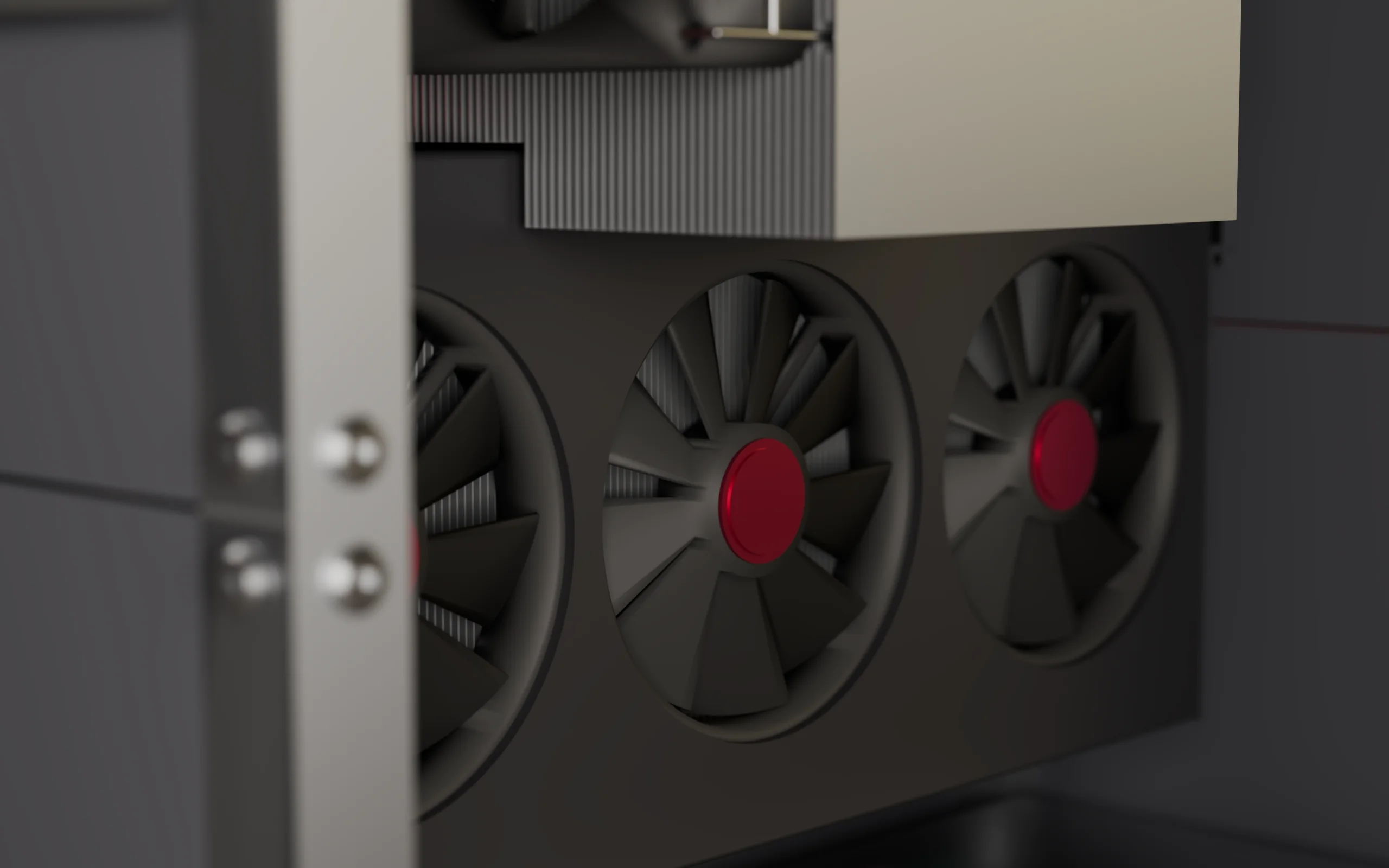 Close on the graphics card inside the machine: three fans with garnet hubs under an aluminium fin stack, the frame and a panel edge in front.