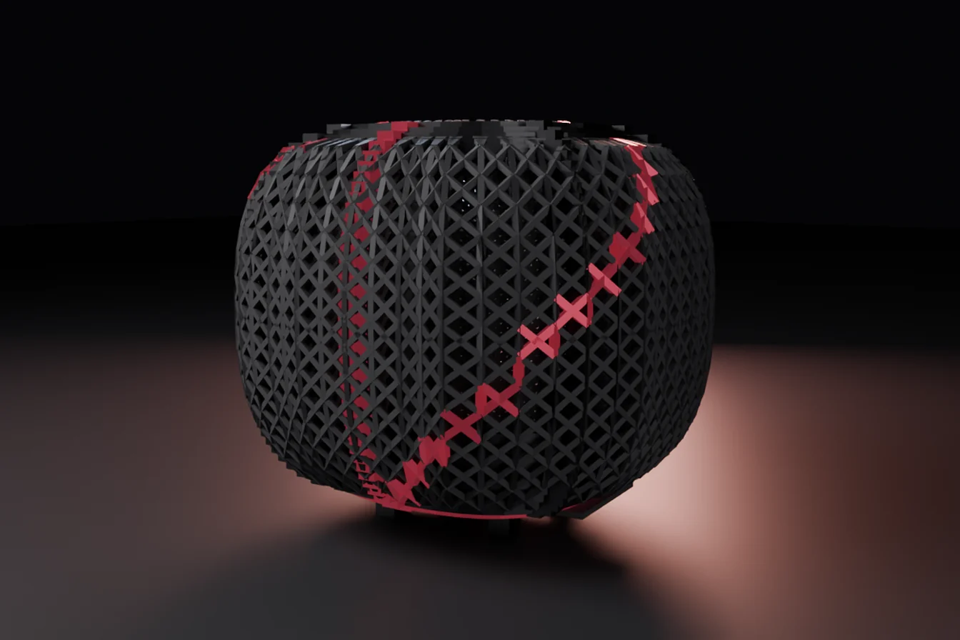 The Garnet machine closed: a rounded cage of fine dark struts woven in a diamond lattice, standing clear of the floor on four low feet, with a deep red line of garnet members running diagonally across its face and a warm pool of light on the floor behind it.
